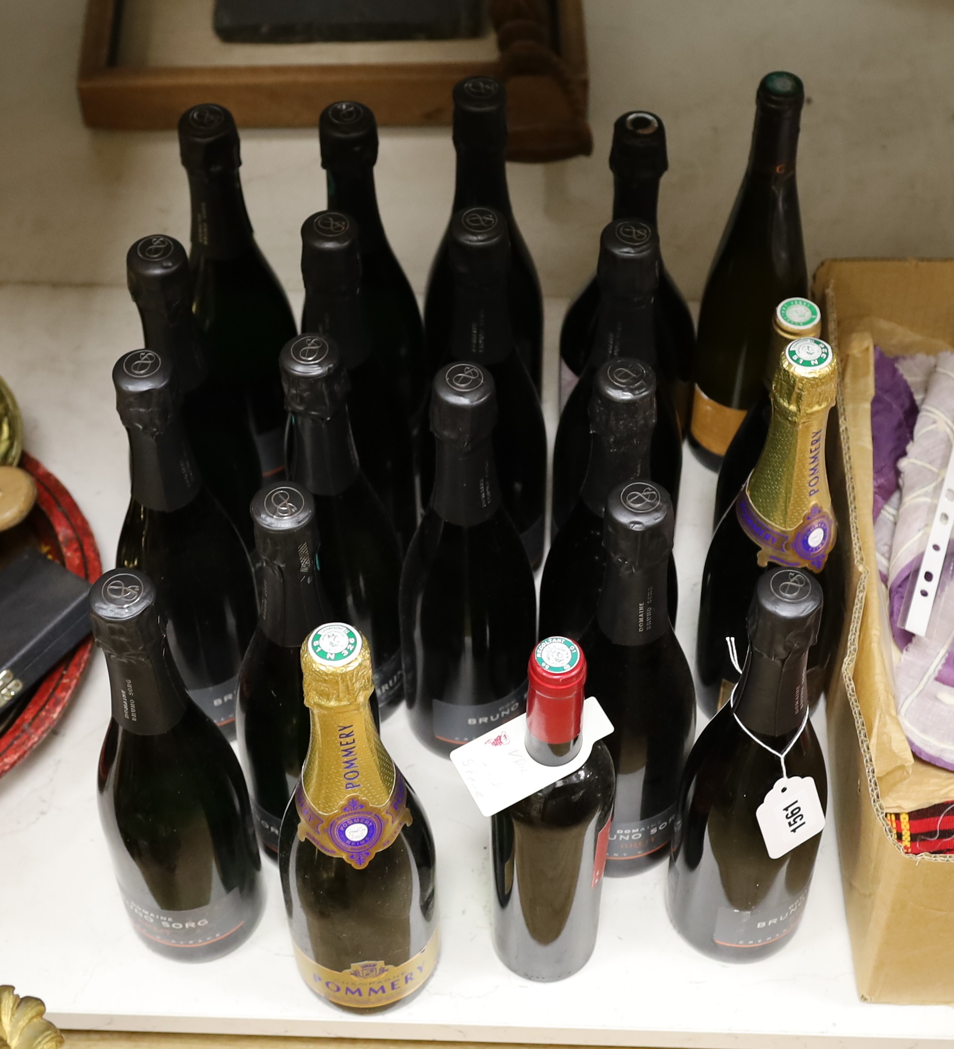 Twenty bottles of alcohol, mostly champagne including Domaine Bruno Sorg Brut and Champagne Pommery and a bottle of sparking tea